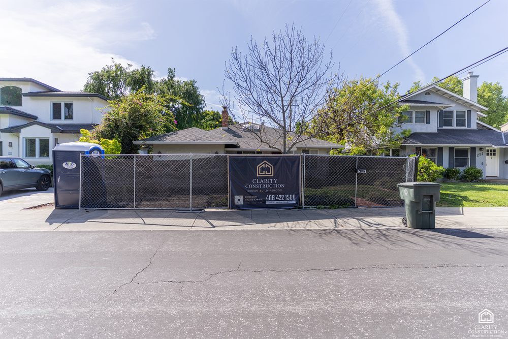 Front of the house behind the construction fence during the renovation