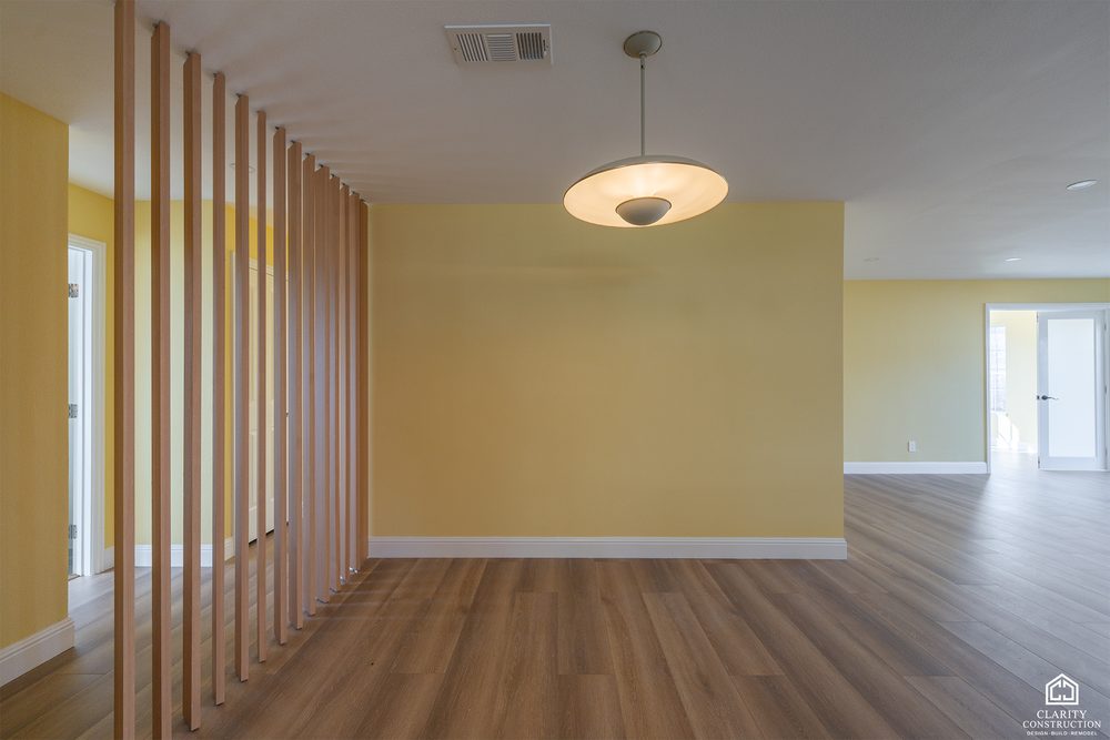 Slatted wood screen between the entry and the living room