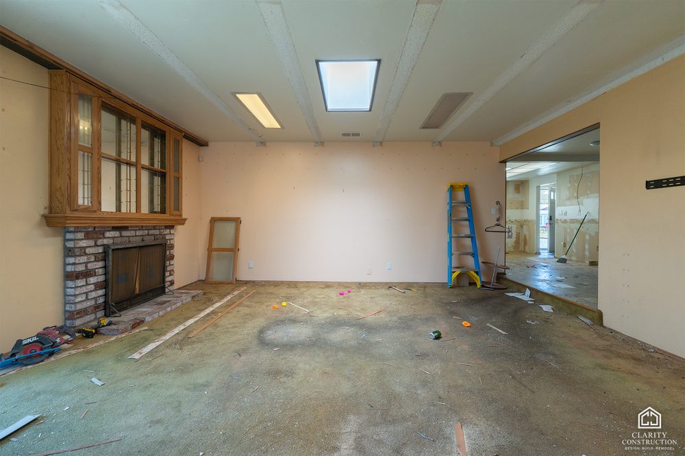The original brick fireplace and skylight before the rebuild