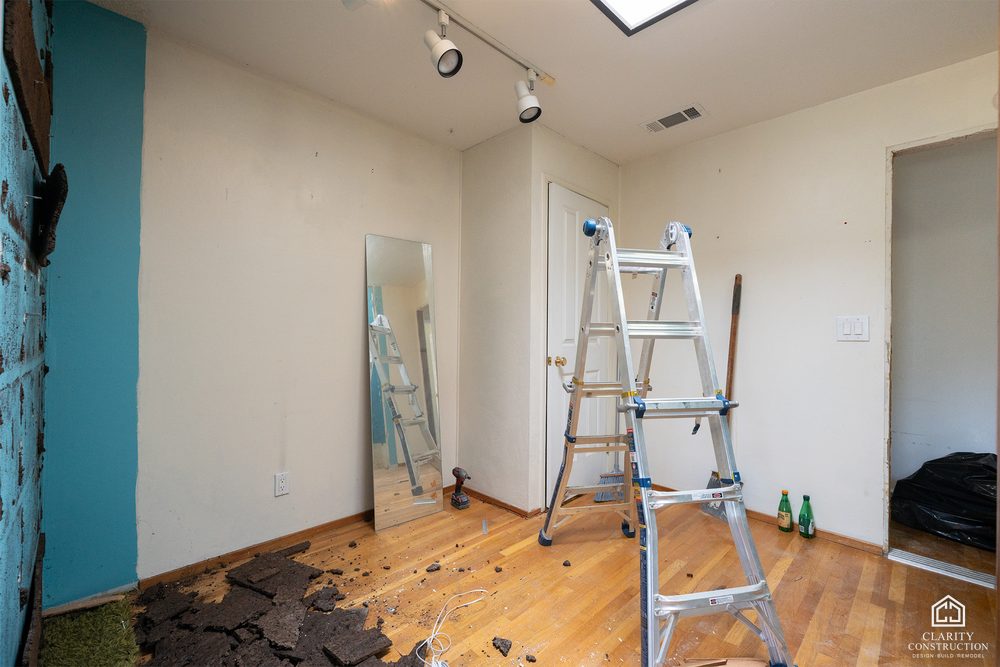 The original bathroom stripped out with the plumbing exposed