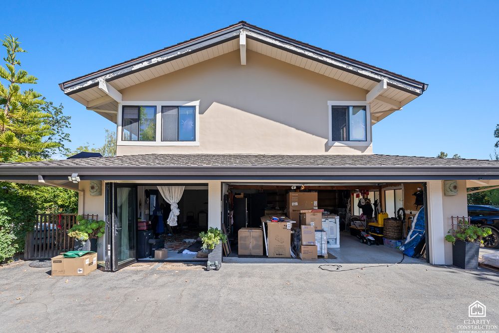 The converted garage from the driveway with its new windows and finished exterior
