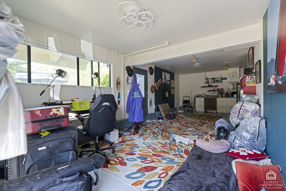 The garage before the conversion, used as a cluttered storage room
