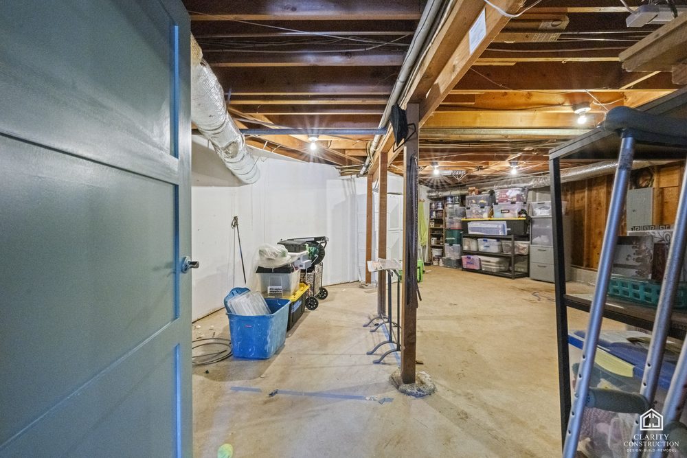 The garage before the conversion, open to the studs and used for storage