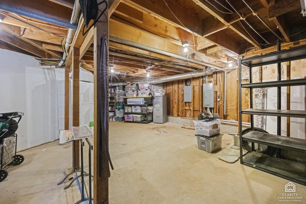 The open-framed garage with storage shelves before the conversion began