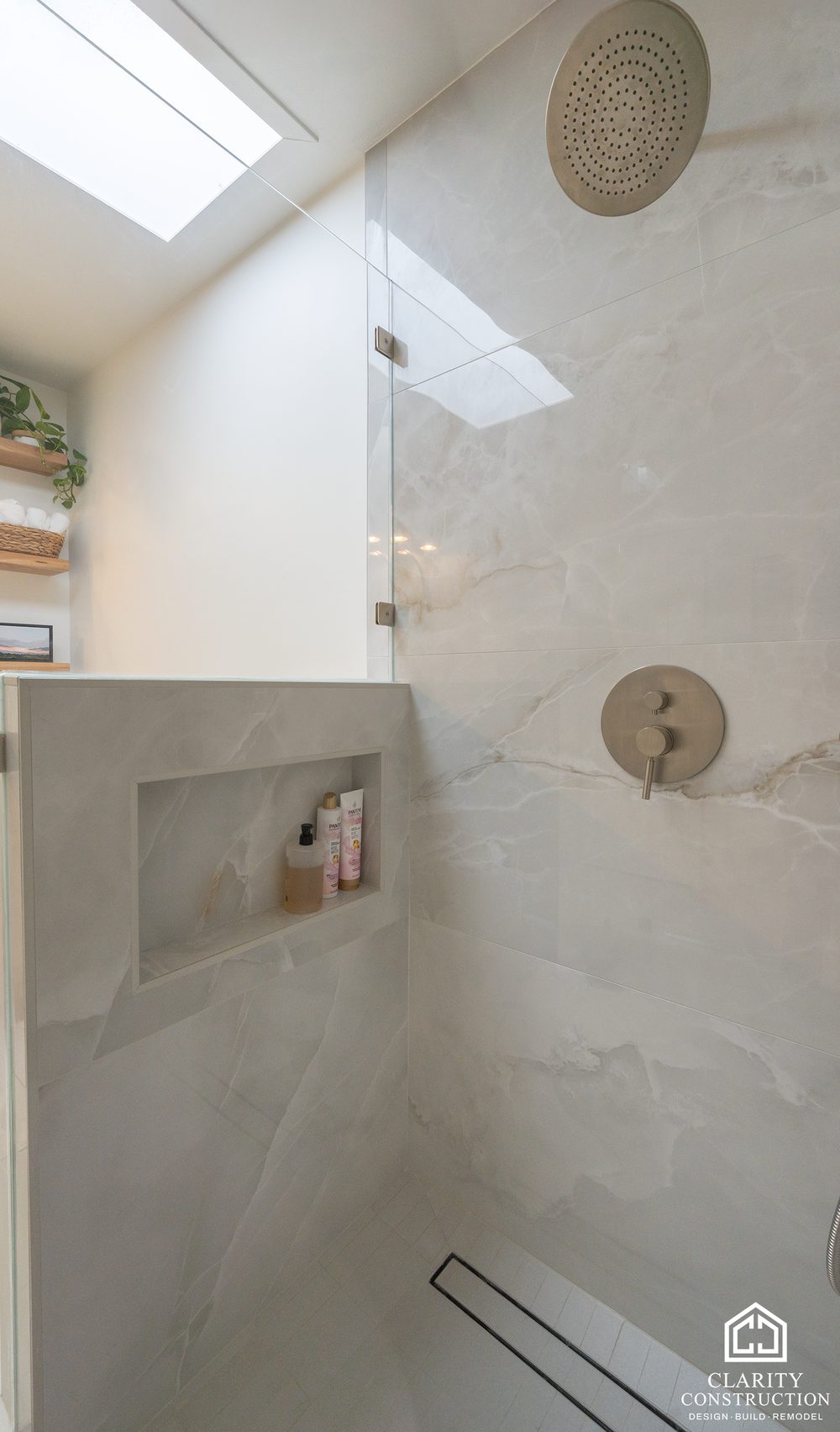 Tall tiled niche in the shower under a skylight