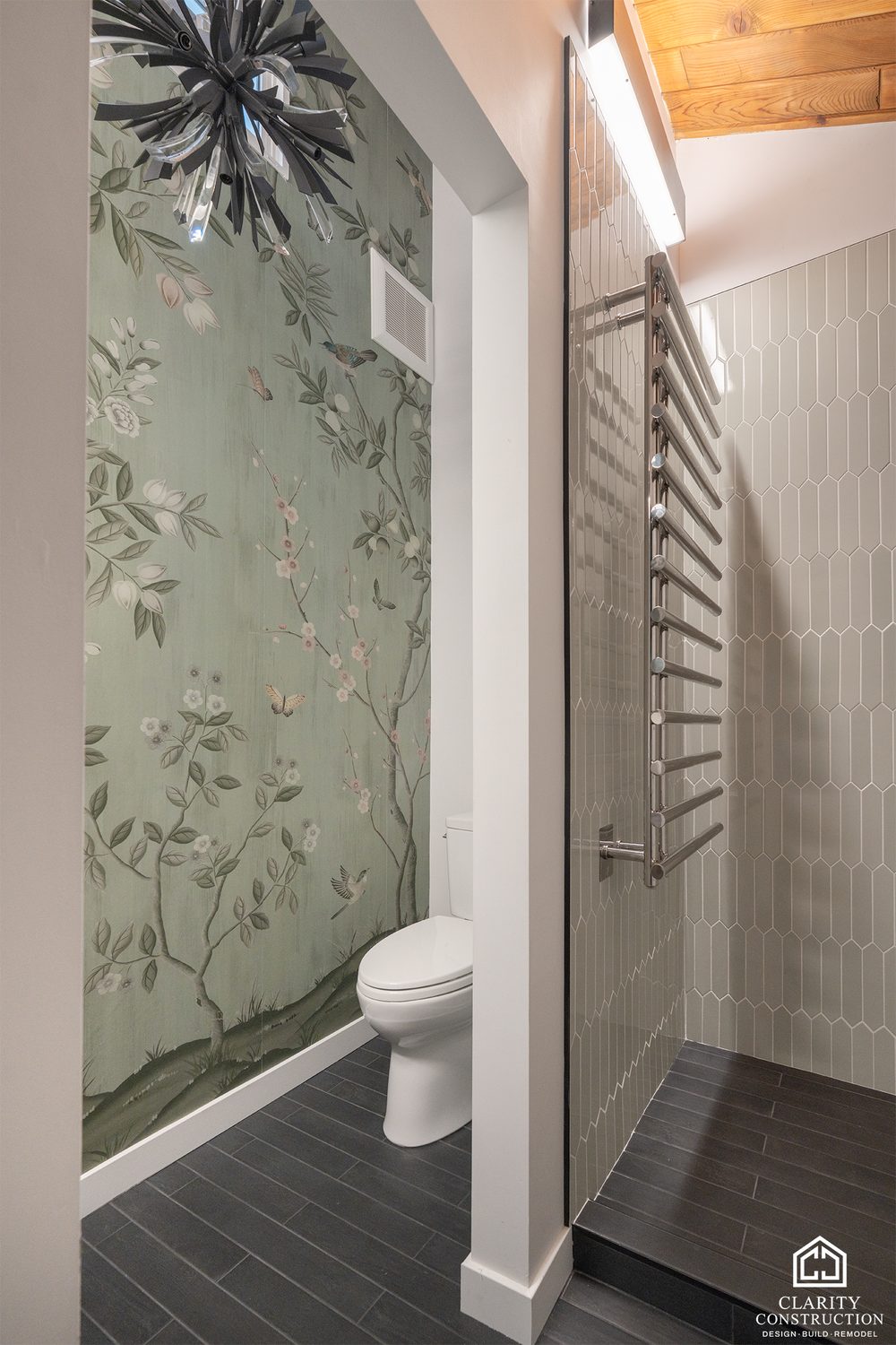 Second bathroom with floral wallpaper, a towel warmer and a picket-tile shower