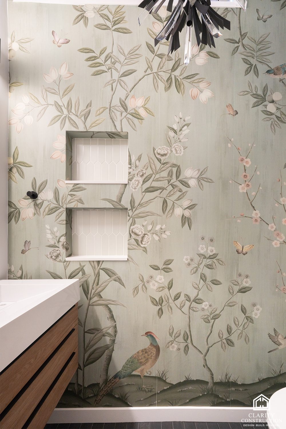Floral wallpaper beside a picket-tile shower with a recessed niche