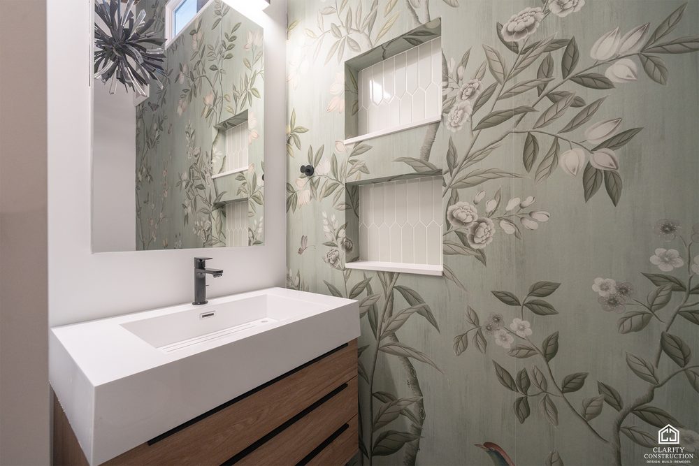 Second bathroom with a floating oak vanity, a niche and floral wallpaper