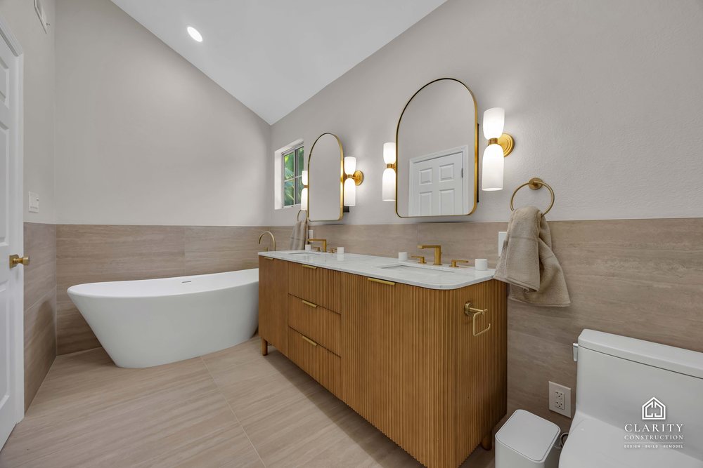Primary bath: tub, vanity and the skylight overhead