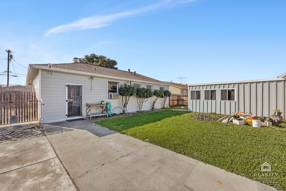 Before: the back yard and exterior of the Fremont ranch house before the remodel