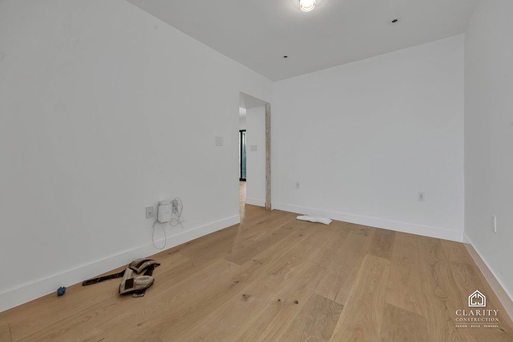 In progress: floors, lighting and the green-tiled bathroom going in at the San Francisco whole home remodel