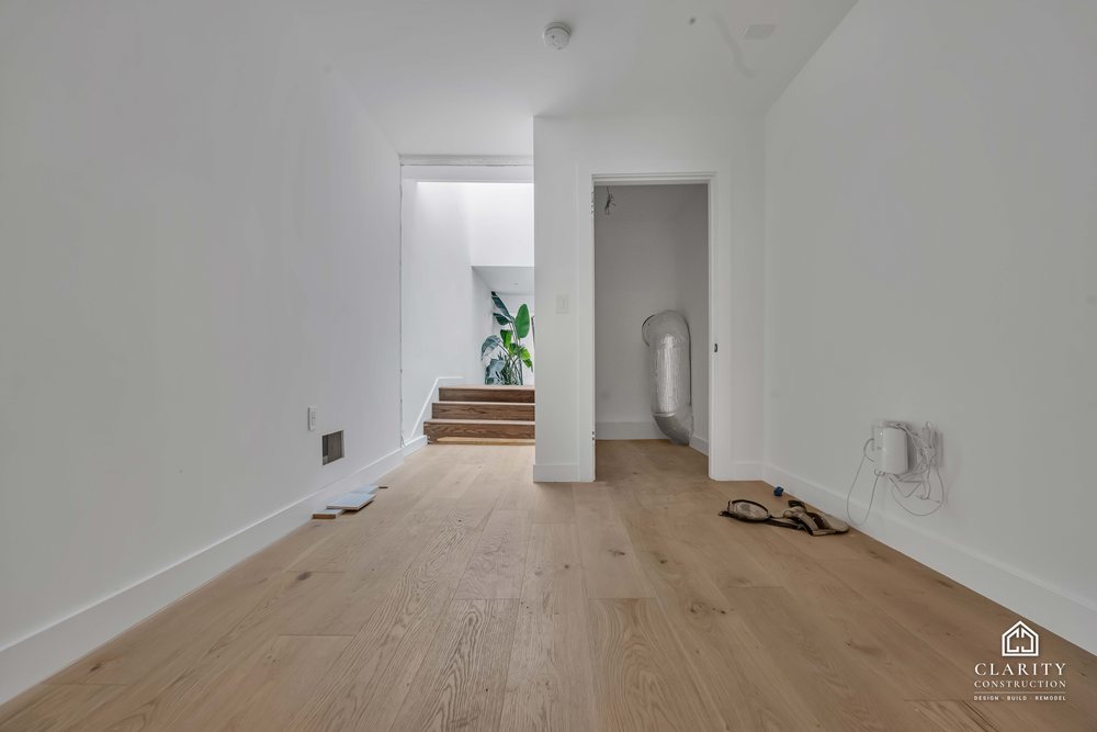 In progress: floors, lighting and the green-tiled bathroom going in at the San Francisco whole home remodel