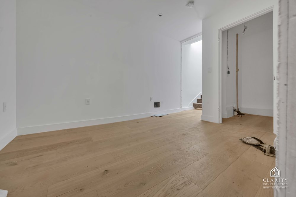 In progress: floors, lighting and the green-tiled bathroom going in at the San Francisco whole home remodel