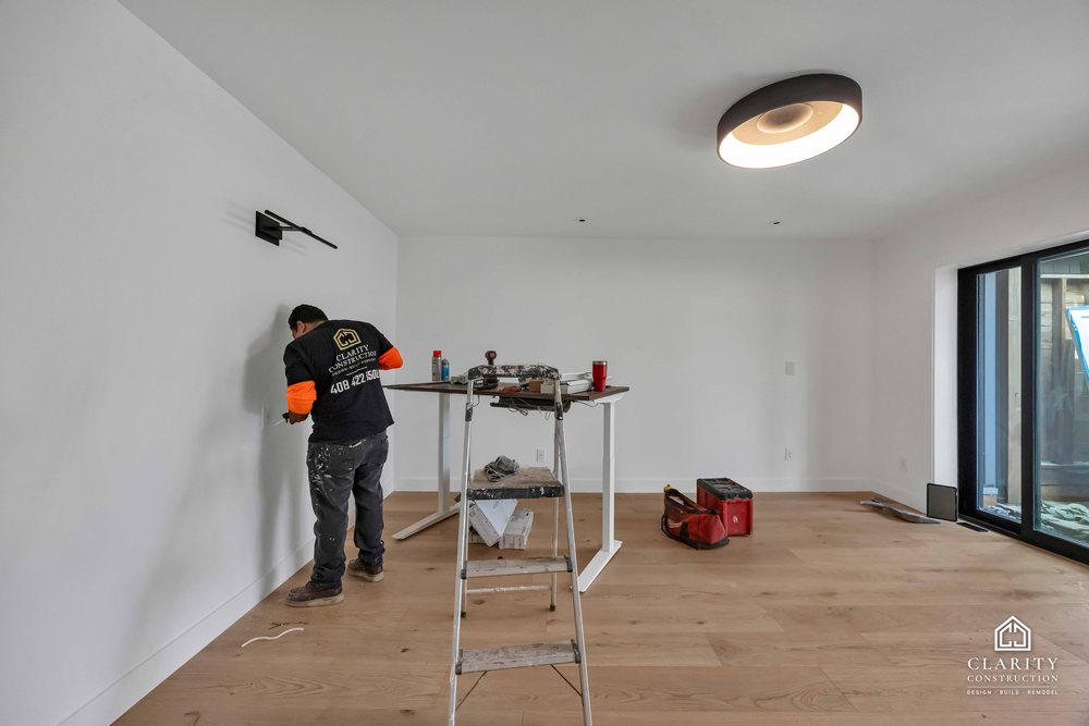 In progress: floors, lighting and the green-tiled bathroom going in at the San Francisco whole home remodel