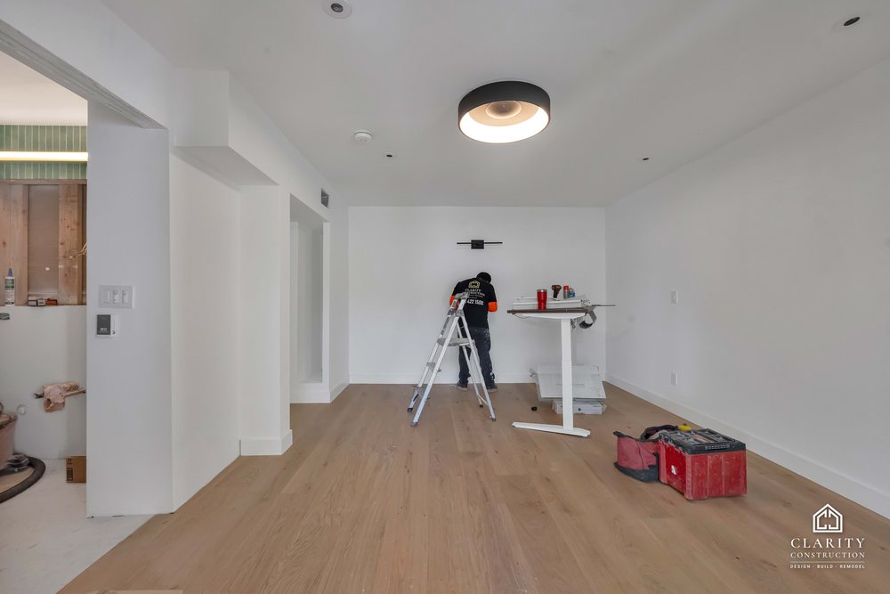 In progress: floors, lighting and the green-tiled bathroom going in at the San Francisco whole home remodel
