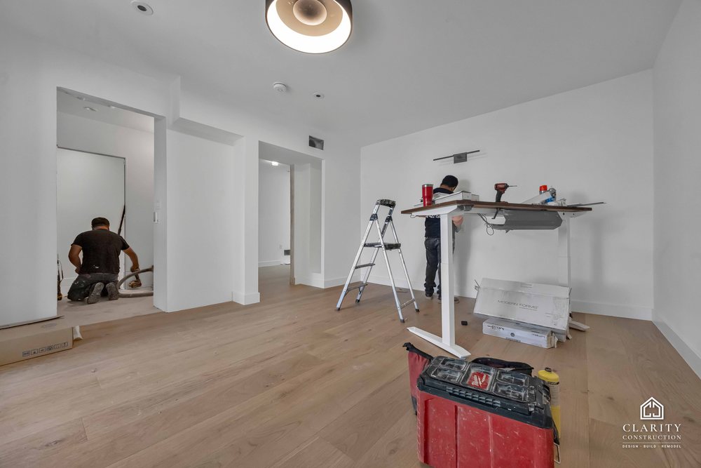 In progress: floors, lighting and the green-tiled bathroom going in at the San Francisco whole home remodel