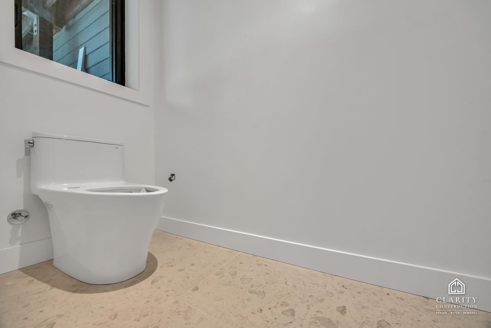 In progress: floors, lighting and the green-tiled bathroom going in at the San Francisco whole home remodel