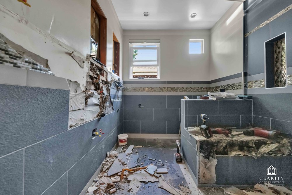 In progress: gray tile and the mosaic band going up in the San Jose bathroom
